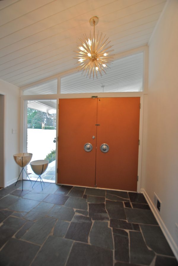 inside, round off the orange front door with a beautiful chandelier and authentic slate floors