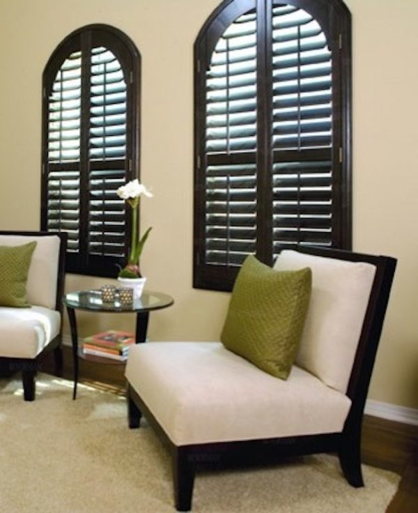 paint the shutters for your arched windows in black walnut to create a lovely contemporary living room