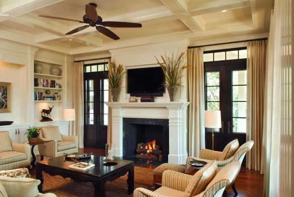 style an elegant living room featuring custom french doors with transom and dark wood floor