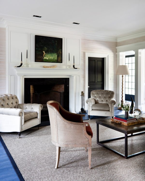 this formal living room uses black doors and white trim to evoke an upscale and sophisticated air
