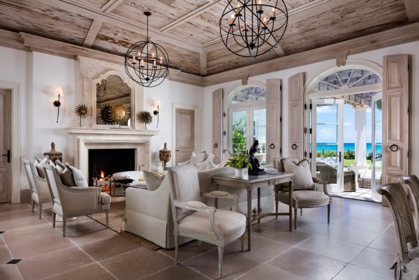 try a mediterranean living room featuring french doors with transom and formal ceramic tiles