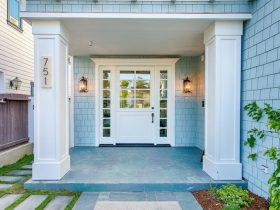 try a white front dutch door that enhances the blue surfside exterior and cool stone porch