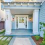 try a white front dutch door that enhances the blue surfside exterior and cool stone porch