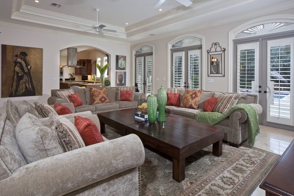 use site white sw walls and shutters for arched windows to create a welcoming family room