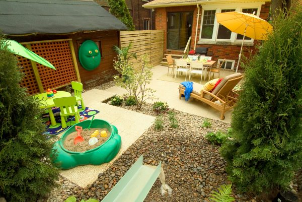 add a sandbox to a small backyard with no grass for a fun, kid-friendly space