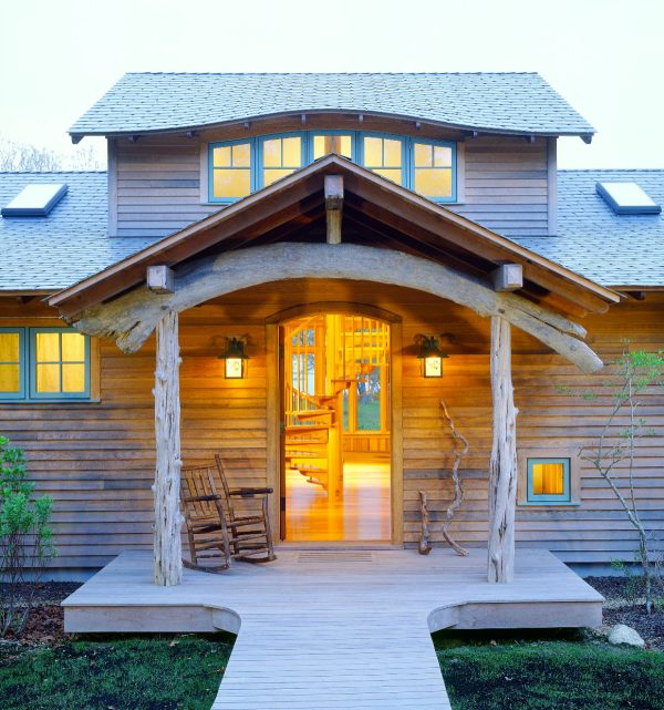 choose sinker cypress as the log cabin siding that enhances the single front door design