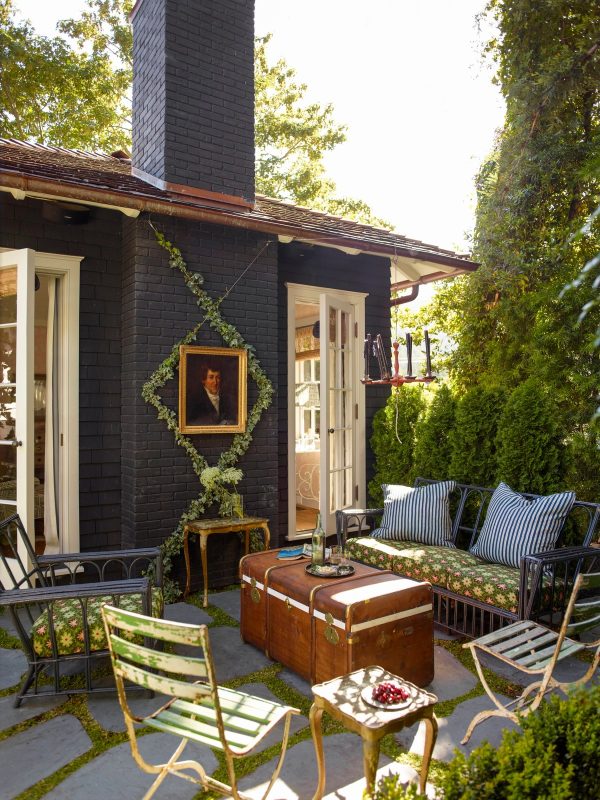 consider rustic furnishing and vines for an eclectic, victorian-inspired small backyard with no grass
