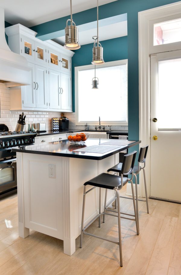 create a timeless kitchen featuring sherwin williams sw-7619 labradorite teal accent wall and classic pieces