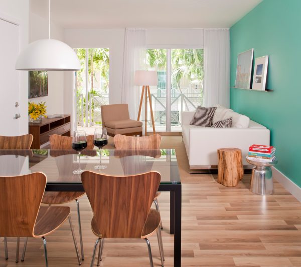 go for a bright and trendy style with a sw 6937 tantalizing teal accent wall and various wood elements