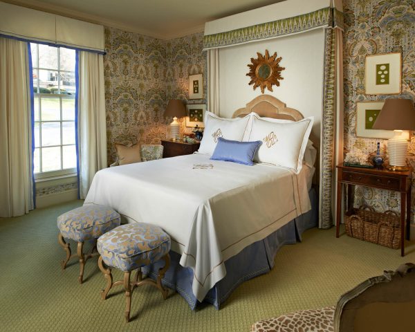 go for an old-school dark green carpet with dark and beige tone wall color combination for a timeless bedroom remodel
