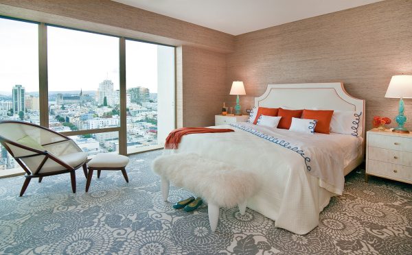 this artistic gray wool carpet from stark and beige wall color combination creates a trendy bedroom vibe