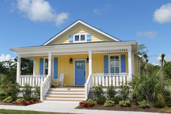 this bm golden honey yellow house with valspar’s ships ahoy blue shutters sports a lovely beach style