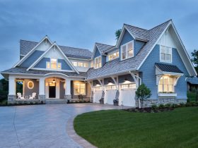 this charming blue-gray house uses sherwin williams storm cloud fuses traditional and modern architecture