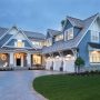 this charming blue-gray house uses sherwin williams storm cloud fuses traditional and modern architecture