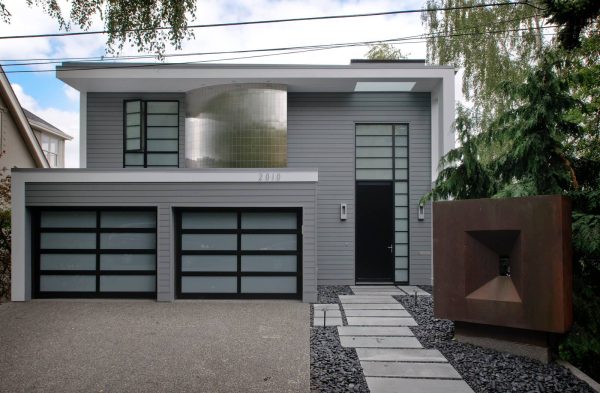 this striking contemporary blue-gray house uses benjamin moore steep cliff gray and painted hardi panel soffit