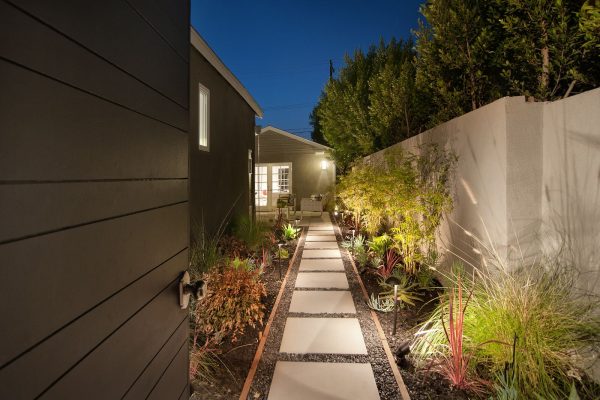 this timeless landscaping makes a small backyard with no grass feel calming and peaceful