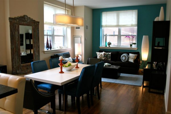 try valspar's moonlit surf teal accent wall in an open concept living space for a modern and snug ambiance