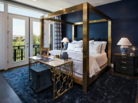 accentuate your royal blue bedroom with striking gold features for a lavish and plush effect