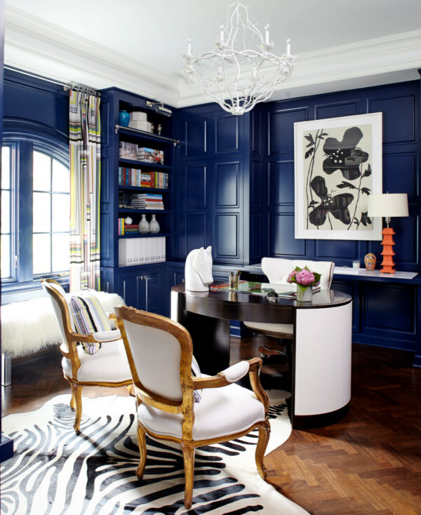 benjamin moore’s admiral blue is perfect for a navy office with vintage chairs and wood flooring
