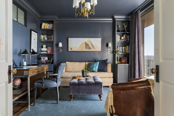 build a bookshelf alcove in your navy blue office to create a charming focal point