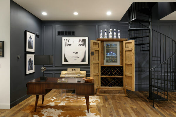 get a cool ambiance in your navy blue office using sherwin williams “cyberspace” walls and a rustic wine cabinet