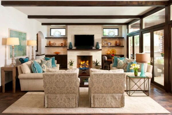 go for an eclectic family room with mahogany ceiling beams and floating shelves next to the fireplace for a modern decorative piece