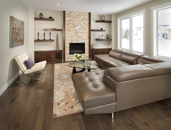 place a cozy sectional sofa to complement stained maple floating shelves next to fireplace for a stunning display