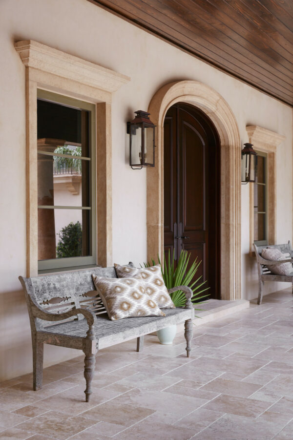 place rustic benches on cobbled edge front porch travertine stone tile for a mediterranean style