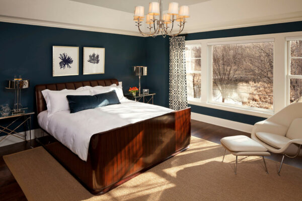 use a brown bed with benjamin moore’s in the midnight hour wall and white dove trim for the ultimate royal blue bedroom