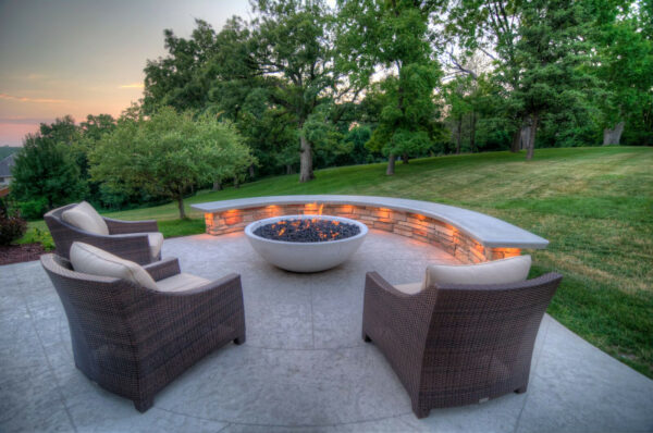 a limestone white stamped concrete patio with a fire pit can be a perfect outdoor spot with an underlit seat wall