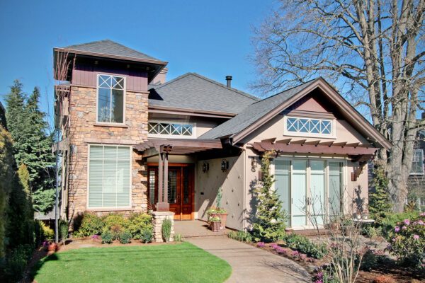 build a brown front door pergola to match the beige siding with a gable roof for a cozy traditional feel