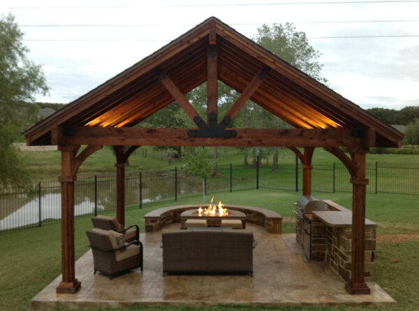 build a stamped concrete patio with a fire pit and pergola in the yard for a lovely outdoor lounge