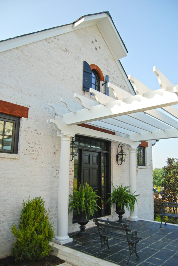 consider pairing your white front door pergola with pressure washed brick siding for a farmhouse vibe