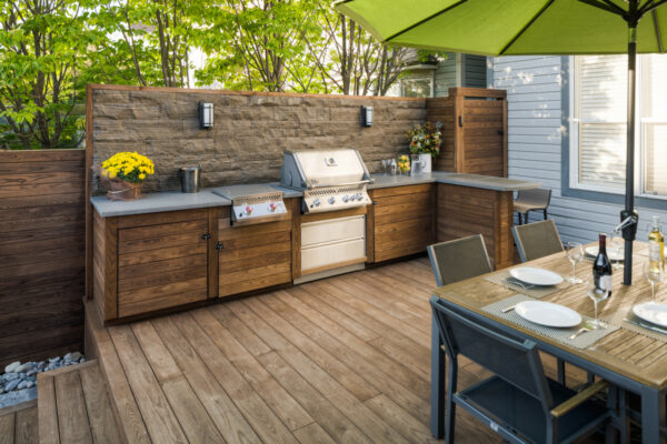install an outdoor kitchen in a small backyard deck for a charming alfresco dining experience