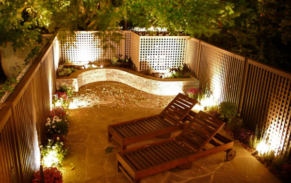 use warm lighting and plants to make the ultimate cozy ambiance on an irregular bluestone patio