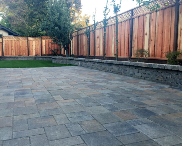 a backyard featuring belgard catalina with weston wall in victorian with toscana splash for a timeless look
