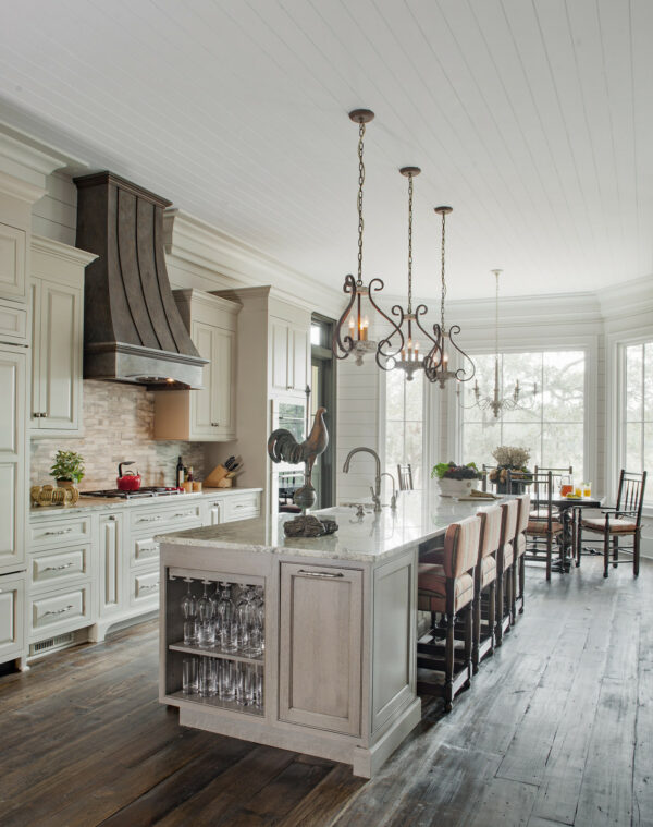 install classic farmhouse cabinets in a galley kitchen with island and reclaimed wood flooring