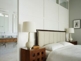 try a white false wall in a grey master bedroom to separate the bathroom in a stylish way