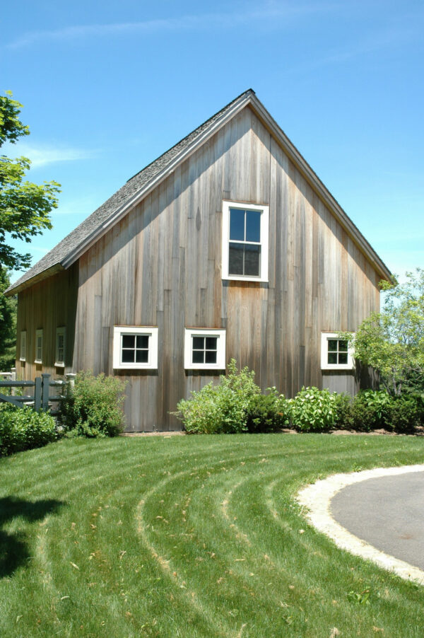 use white window trims with vertical cedar siding and red cedar shingles for a simple detached barn exterior